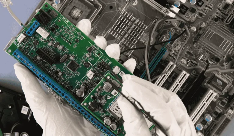 Motherboard with visible damage, showing common signs of faulty motherboard symptoms and potential repair areas.